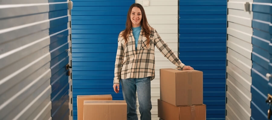 Image of a young woman at a storage unit.