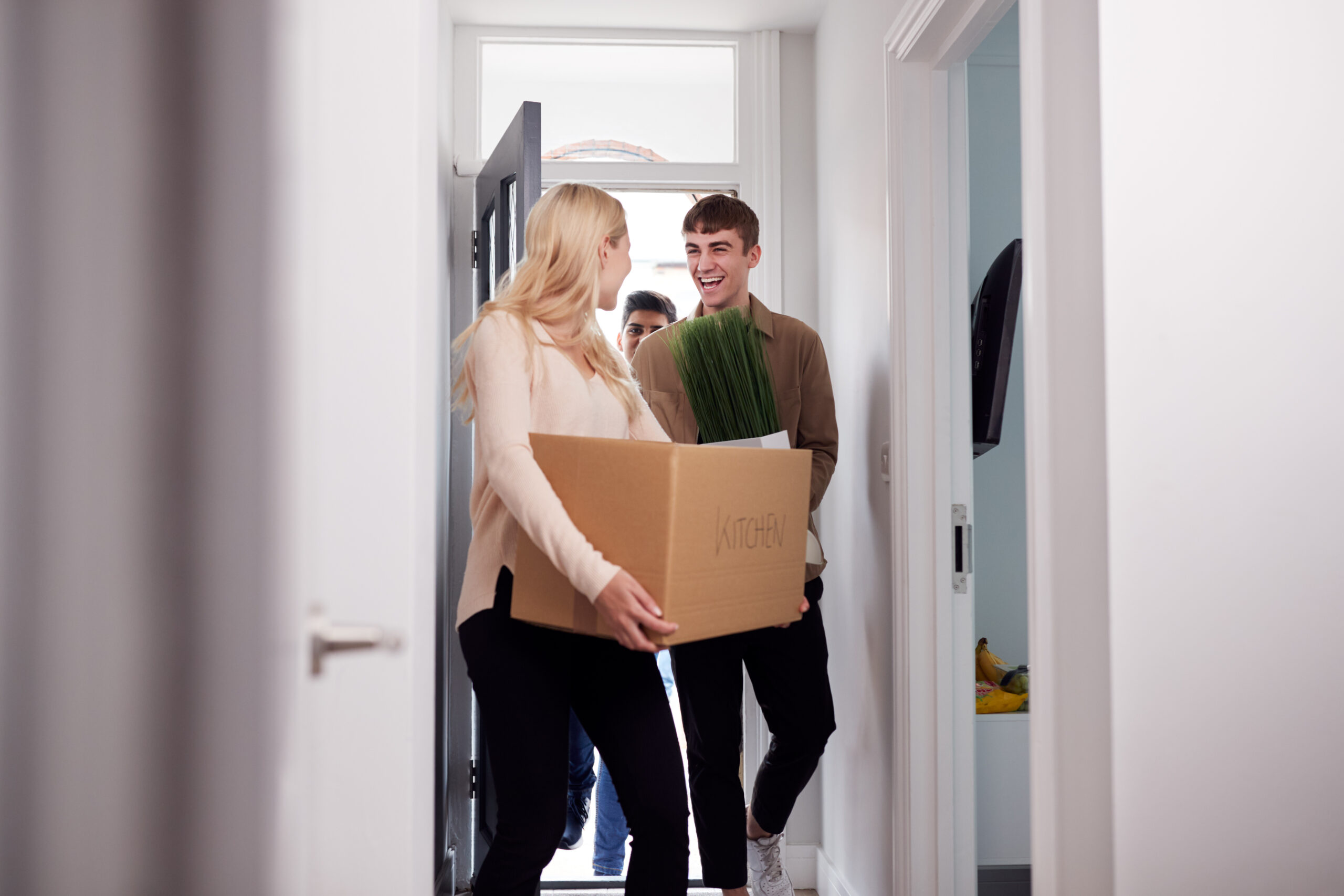 An image of a couple of students moving into their student accomodation.