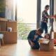 A family including two parents and a child packing boxes because they are moving to Reading.