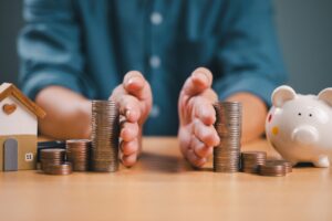 An image of someone splitting an mage of coins to indicate splitting assets in a divorce.