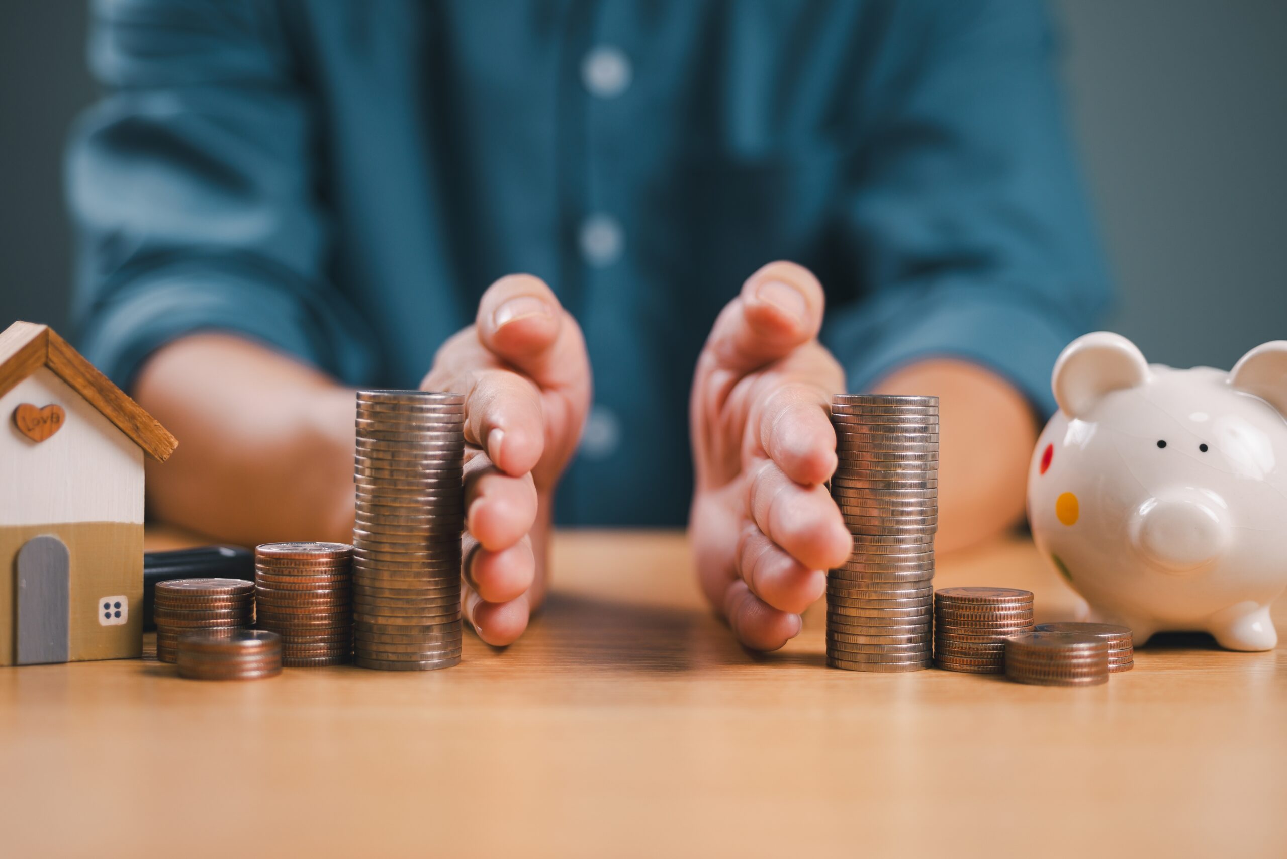 An image of someone splitting an mage of coins to indicate splitting assets in a divorce.
