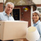 A couple packing their belongings and getting ready to downsize.