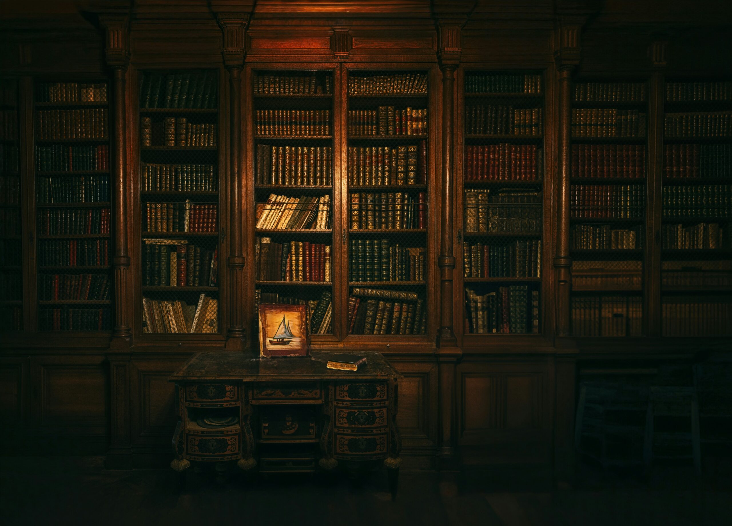 A large book cabinet full of antique books.